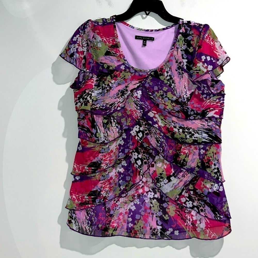 Sara Michelle purple black white green floral top. Size medium.